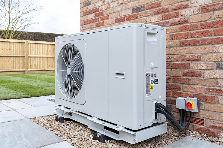 Air Source heat pump fitted outside a new home development