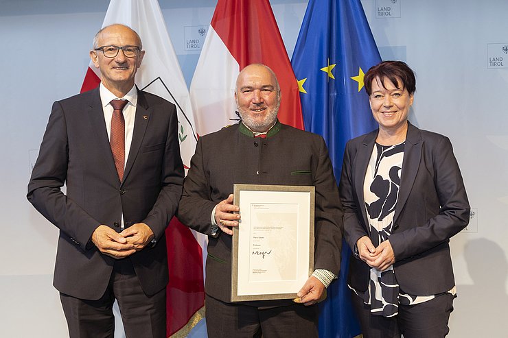 © Land Tirol/Die Fotografen Drei Menschen auf einem Foto.