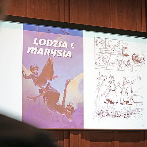 Aufnahme einer Leinwand mit einem Coverbild.