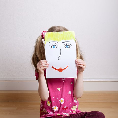 Little,Blonde,Girls,Holding,Happy,Face,Mask