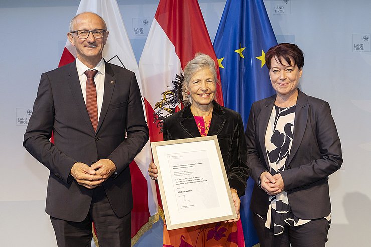 © Land Tirol/Die Fotografen Drei Menschen auf einem Foto.