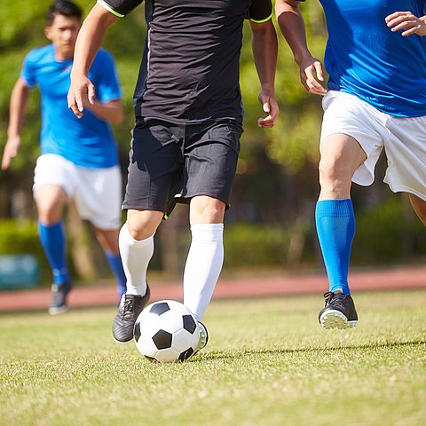 A,Group,Of,Young,Asian,Soccer,Football,Player,Playing,On